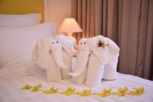 Ліжко або ліжка в номері Palmier Hotel - Art House Da Nang