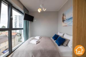 Posteľ alebo postele v izbe v ubytovaní Apartamenty Horyzont - visitopl