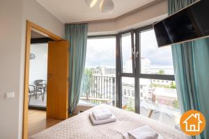 Posteľ alebo postele v izbe v ubytovaní Apartamenty Horyzont - visitopl