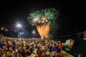a large crowd of people watching a fireworks show at VILLA Juky in Kaštela +48 photos