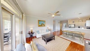 a living room with a couch and a table at Lake Views, 2BR, 2BA, Lakeside Villa in Pawleys Island