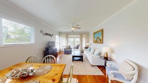 a living room with a couch and a table at Lake Views, 2BR, 2BA, Lakeside Villa in Pawleys Island
