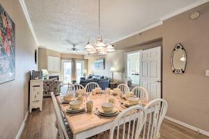 a dining room and kitchen with a table and chairs at Steps to Beach Ocean City Getaway with Pool Access! in Ocean City
