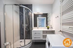 Kúpeľňa v ubytovaní Apartamenty Horyzont - visitopl