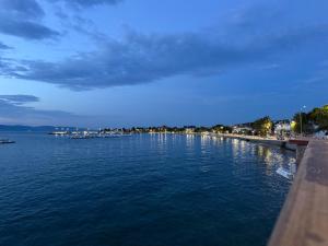 a view of a body of water at night at Rozy Studios in Pefki