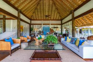 a living room with couches and a table at Casa Saman in La Romana