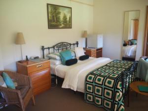 מיטה או מיטות בחדר ב-Yarrahapinni Homestead