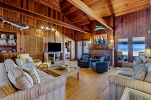 a living room with couches and a television in a house at 1180 S Fletcher Ave in Fernandina Beach