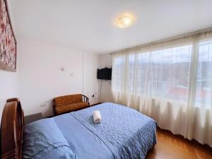 Un pat sau paturi într-o cameră la Departamento Vacacional en el Centro de Loja