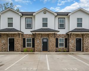a home with a brick exterior at Tee Time Treasures in Sango 1625 Gold Club Ln #602 in Nashville