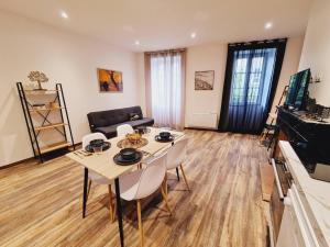 a living room with a table and chairs at Rep - 3B in Millau
