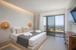 Ένα ή περισσότερα κρεβάτια σε δωμάτιο στο Athoros Luxury Villas