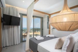 Ένα ή περισσότερα κρεβάτια σε δωμάτιο στο Athoros Luxury Villas