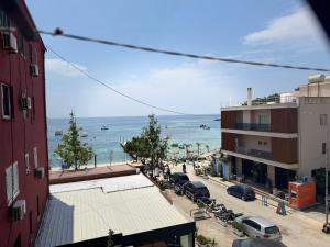 a view of the ocean from a building at RIA apartment in Himare