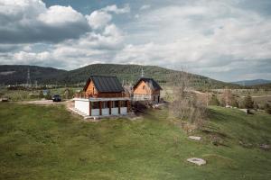 an aerial view of a house in a field at Arhetip, Djedova Villa in Žabljak