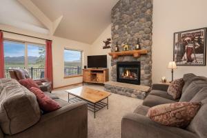 a living room with two couches and a fireplace at Private Garage, Washer and Dryer, Amazing Views of Byers Peak, Pet Friendly in Fraser