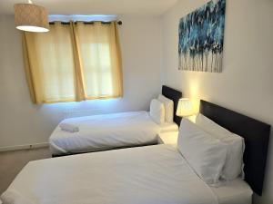 Ένα ή περισσότερα κρεβάτια σε δωμάτιο στο Ocean Home stay