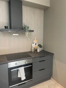 a kitchen with a stove and a counter top at Familiy apartment in Myrkdalen Voss in Vossestrand
