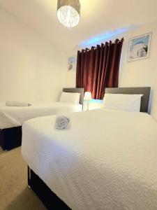 Ένα ή περισσότερα κρεβάτια σε δωμάτιο στο Ocean Home stay
