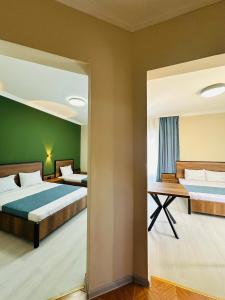 Postel nebo postele na pokoji v ubytování Hotel albatros shekvetili