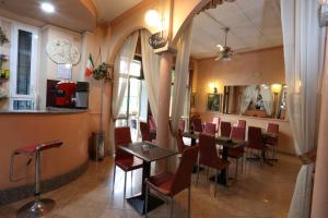 a restaurant with a table and chairs in a room at Hotel Piola in Milan