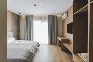 Postel nebo postele na pokoji v ubytování Siel Hotel