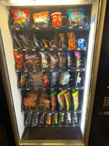 a refrigerator filled with lots of snacks and drinks at Two Bedroom Deluxe Sea View Guest Suite in Inis Mor