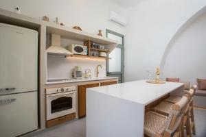 Η κουζίνα ή μικρή κουζίνα στο Athoros Luxury Villas