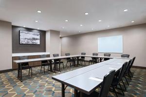a conference room with tables and chairs and a whiteboard at Residence Inn by Marriott Houston NW Cypress in Cypress +22 photos