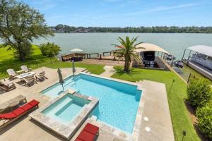 an overhead view of a swimming pool next to a lake at La Costa Drive in Montgomery