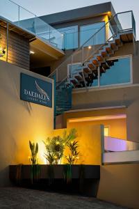 a building with a staircase and a sign on it at Daedalus Luxury Home - Seaview & Heated Pool in Kontokali