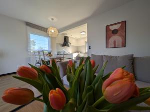 a bouquet of tulips in a living room at Chill House in Zator