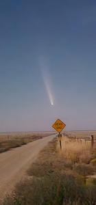 a road sign on the side of a dirt road at Roswell Alien Sightpoint 