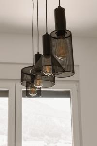 a chandelier hanging in front of a window at Big Family apartment - 3BR in Budva