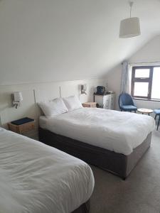 Rúm í herbergi á Lios Éinne House Accommodation