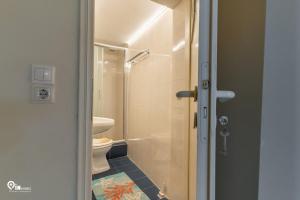 a bathroom with a toilet and a shower at 'Omiros' Central Cozy House In Poro Island in Poros