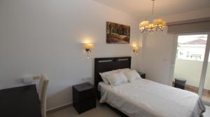 Katil atau katil-katil dalam bilik di Mahogany Suites by Skyreach Group