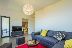 Televízia a/alebo spoločenská miestnosť v ubytovaní Villa Manus - Boutique Apartments