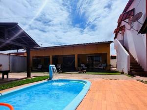 Bazén v ubytování Casa Temporada Suítes nebo v jeho okolí