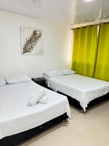 Cama o camas de una habitación en Tropical Dreams