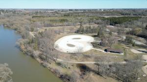 an aerial view of a large swimming pool next to a river at Beautiful Separate Unit, GrandRiver & Kiwanis Park in Kitchener