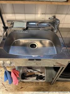 a stainless steel sink in a kitchen with tools at BISHU to YADO in Ichinomiya +18 photos