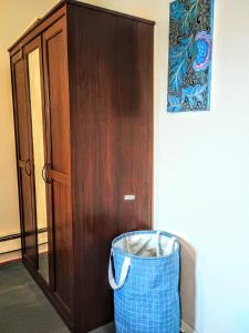 a trash can in front of a wooden door at Explore New York from Queens in Queens +62 photos