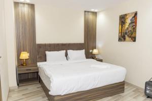 Voodi või voodid majutusasutuse Maktub Pyramids Hotel toas