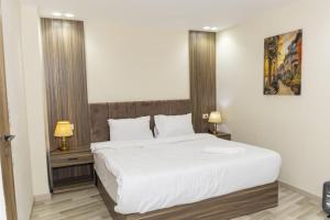 Voodi või voodid majutusasutuse Maktub Pyramids Hotel toas