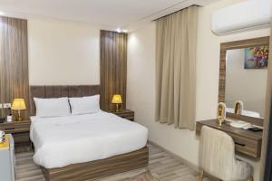 Voodi või voodid majutusasutuse Maktub Pyramids Hotel toas