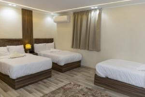 Voodi või voodid majutusasutuse Maktub Pyramids Hotel toas