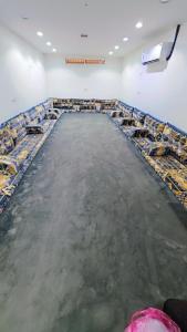 a large room filled with tables and chairs at مسكن خاص داخل عماره بمسبح in Taif +19 photos