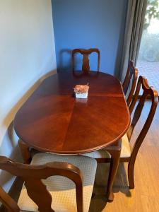 a wooden table and chairs with a bowl on top at Hacienda Isabella in San Felipe +7 photos