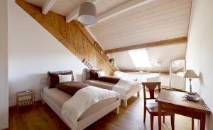 Ein Bett oder Betten in einem Zimmer der Unterkunft La Commanderie